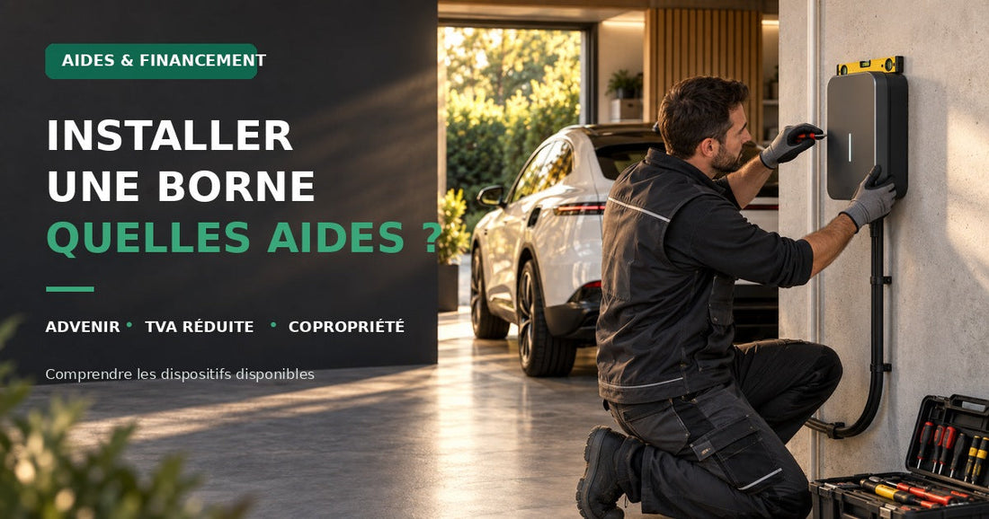 Installateur certifié IRVE fixant une borne de recharge murale dans un garage individuel, aide installation borne de recharge.
